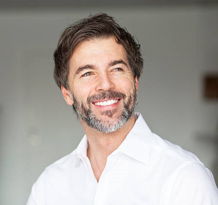 Successful Mature Man Smiling Looking Away